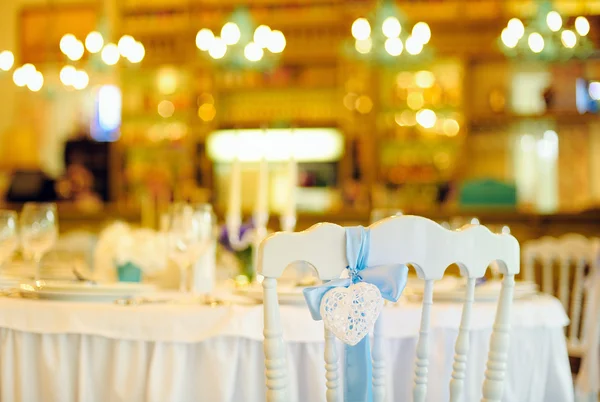 Holiday table and white chair with heart — Stok fotoğraf