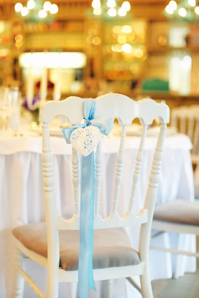 Holiday table and white chair with heart — Stok fotoğraf