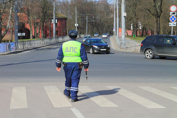 The traffic police officer keeps order