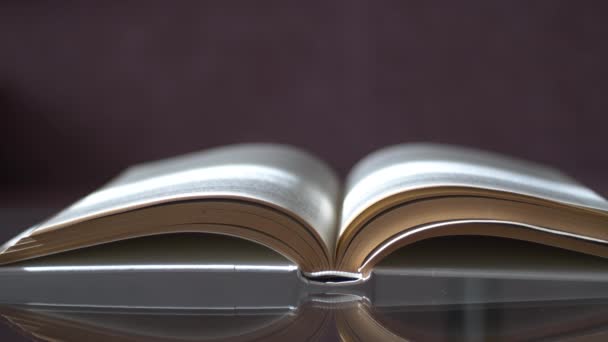 Man Placing Glasses Open Book Library — Stock video