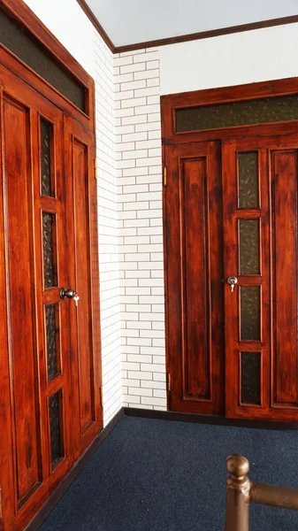 Doors made of natural wood,The two doors in the corner of the house are made of natural wood