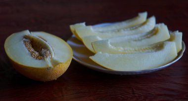               Yellow, ripe melon cut into slices                 
