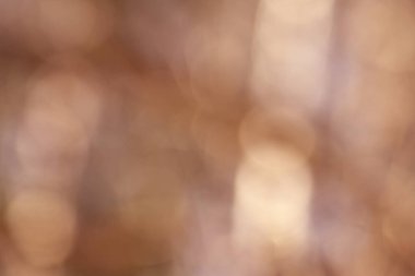 Soyut bir arkaplan olarak bulanık kahverengi bokeh.