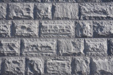 Granit bloklardan oluşan duvar arka plan gibidir.