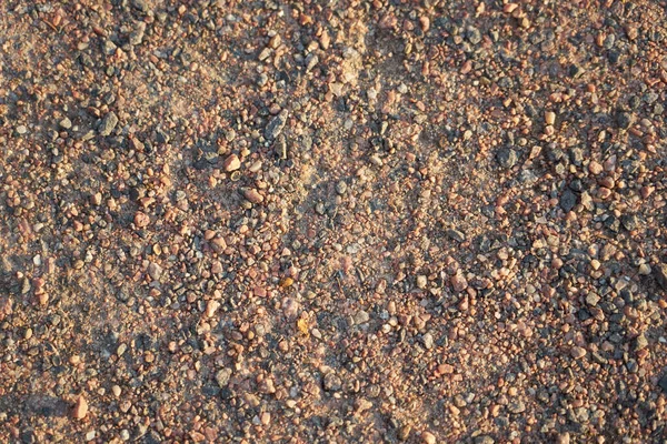 Arka Plan Olarak Küçük Granit Taşlardan Yapılmış Toprak Yol — Stok fotoğraf