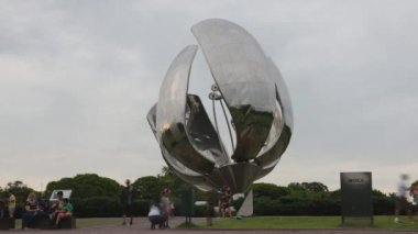 4K timelapse of tourists posing in from of the Floralis Generica in Buenos Aires, Argentina