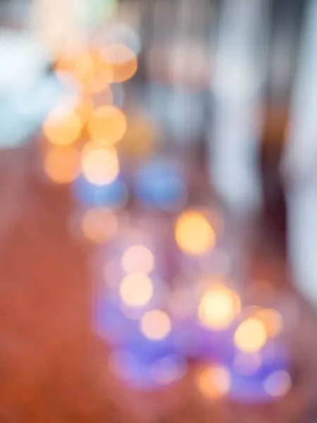 Colorful Bokeh Of Light Candles Background.