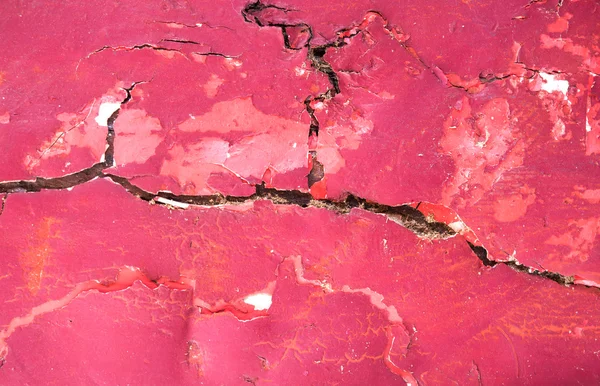 The red surface of the building is cracked abstract background. — Stock Photo, Image