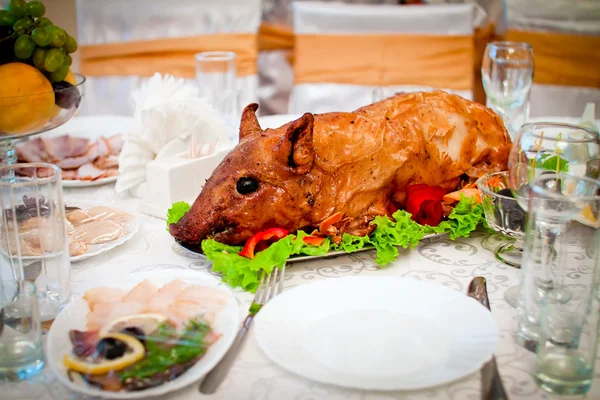 beautiful roast suckling pig on the table
