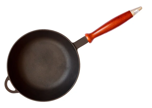 Cast iron skillet with wooden handle — Stock Photo, Image