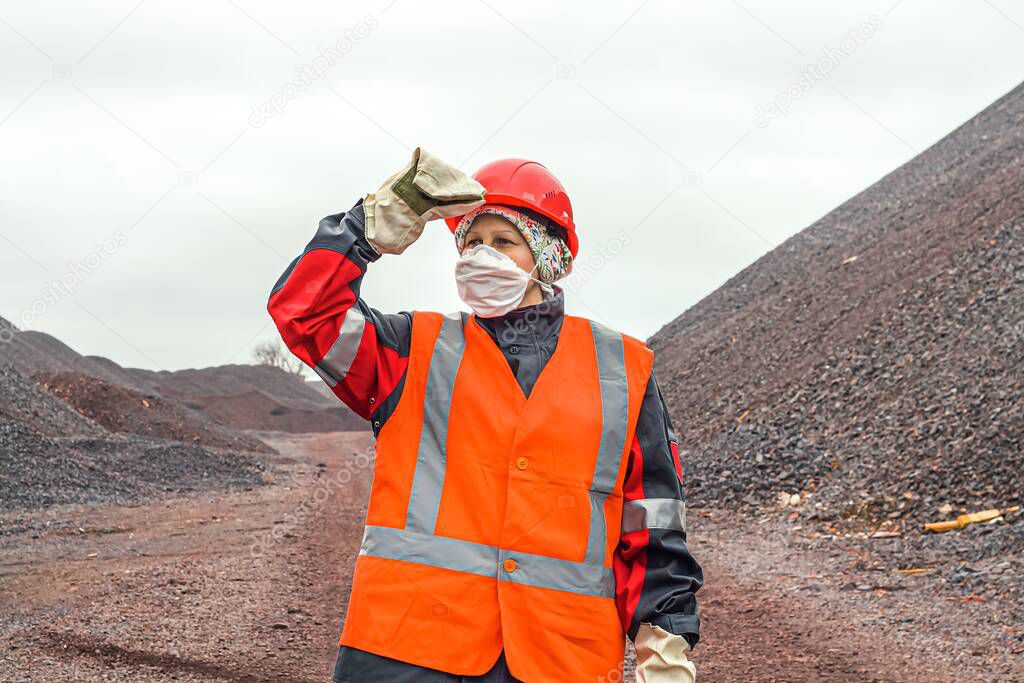 A helmet for protection of the head . Mining industry. A vest with a reflective strip.  Labor protection