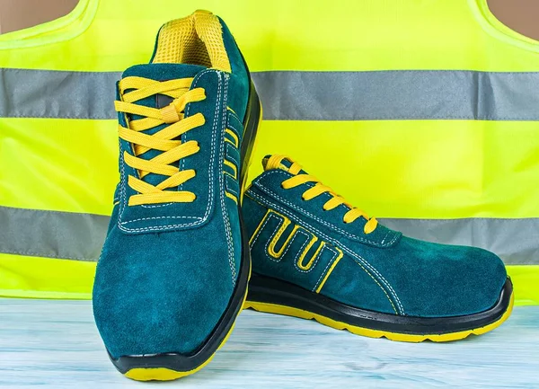 Modern working boots , fashionable green with yellow sneaker