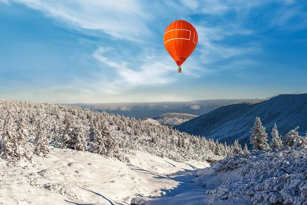 a balloon amid snow in the mountains of Europe. scan from flight altitude.