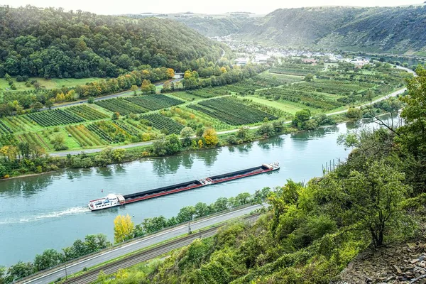 The barge on the river . transport for the delivery of large goods along the river