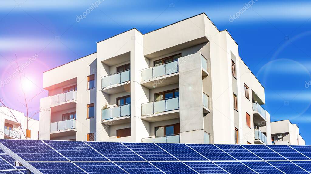 solar panels and facade of apartment building, green energy
