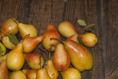 yellow  pears  on a wooden  background clipart