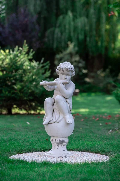 Statue Boy Playing Pipe Park Stock Picture