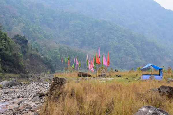 Top River Levees Covered Green Brown Vegetation Boulders Prayer Flags — 스톡 사진