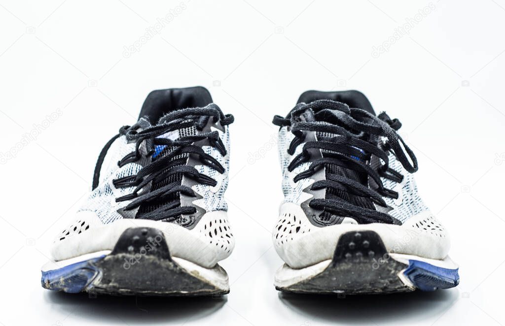 Dej, Romania - January 19 2020: View from above of old dirty Nike Running racing professional shoes on the white background