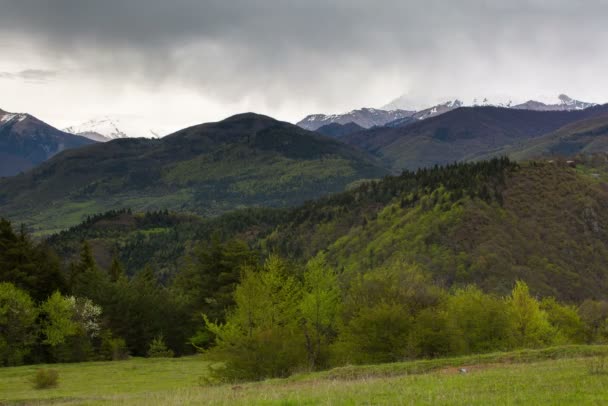 The formation and movement of clouds up to the steep mountain slopes of the  mountains of Central Caucasus peaks. — Stock Video