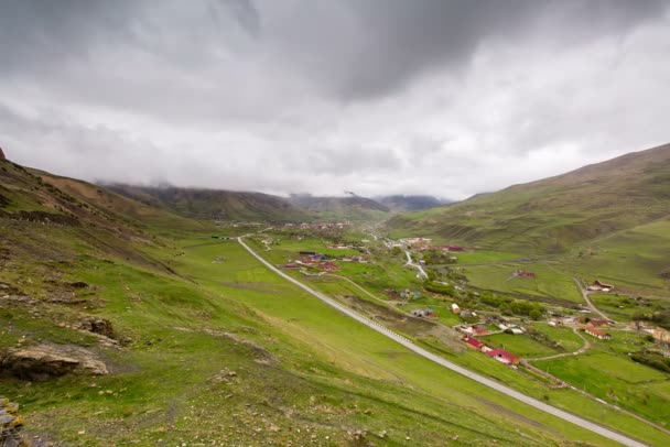 The formation and movement of clouds up to the steep mountain slopes of the  mountains of Central Caucasus peaks. — Stock Video