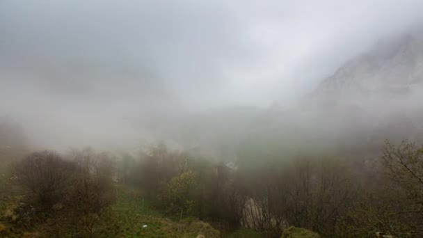 The formation and movement of clouds up to the steep mountain slopes of the  mountains of Central Caucasus peaks. — Stock Video