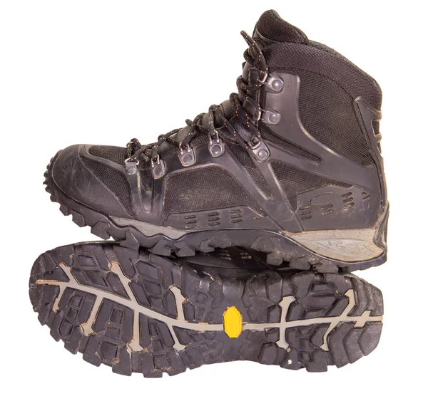 Old black trekking shoes. Royalty Free Stock Images