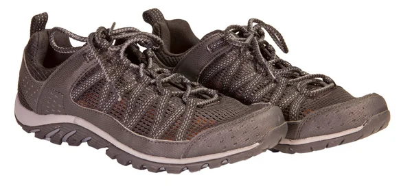 Tracking sport svart sneakers, ventilerande material, isolerade — Stockfoto