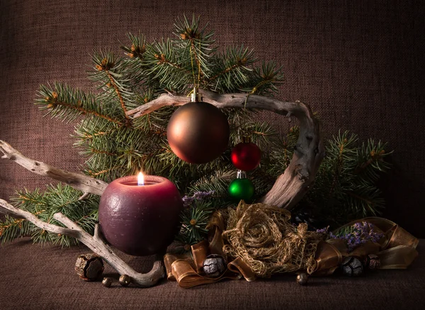 Christmas composition with Christmas tree and decorations, decorated candles and driftwood. — Stock Photo, Image