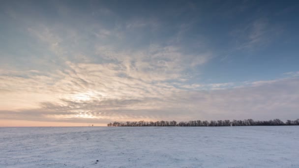 Timelapse. Russia. Rostov region. The movement of the clouds at sunset in the snowy steppe in winter. — Stock Video