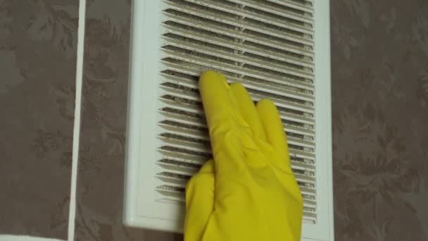A layer of dust on the ventilation grate.Dust is wiped off with a rubber glove. — Stock video
