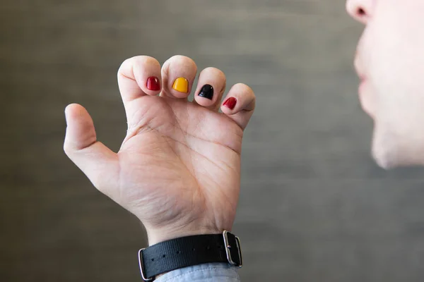 A man with painted nails. Design of male nails. men manicure.