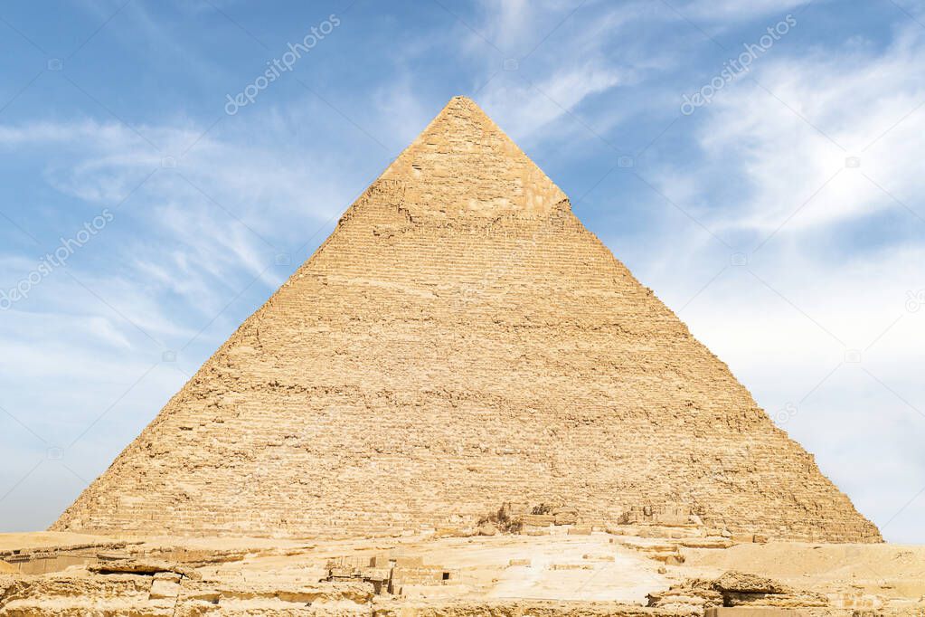 The high largest pyramid of Chephren on the background of a blue sky with clouds, Giza, Cairo, Egypt. second pyramid. Pyramid of Khafra on a cloudy day