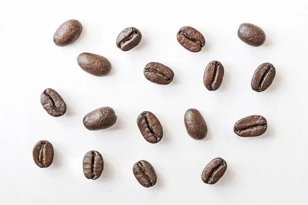 Coffee beans. Isolated on white background. Roasted coffee beans close-up on a white background. macro photo