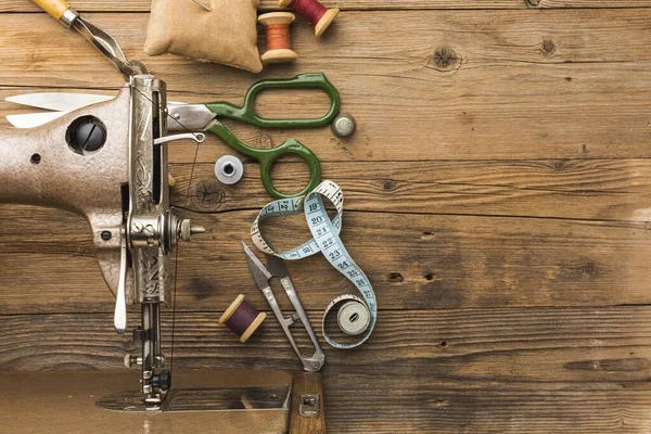 top view of vintage sewing machine with scissors and thread. Resolution and high quality beautiful photo