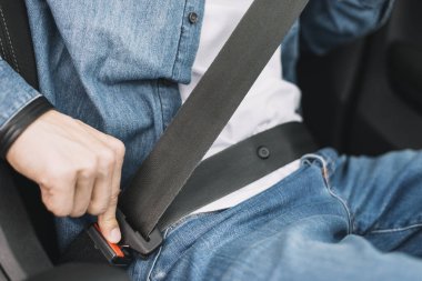 close up man putting safety belt. Resolution and high quality beautiful photo