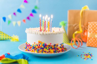 decorative cake with burning candle blue background. Resolution and high quality beautiful photo