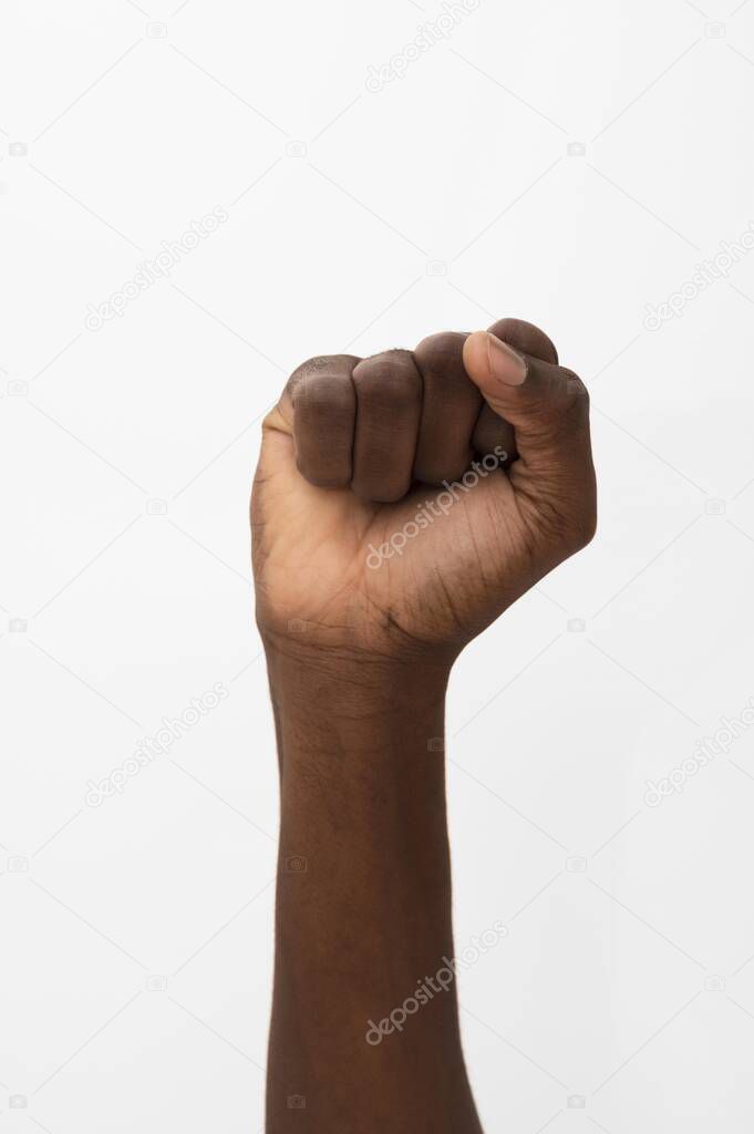 black person holding their fist up. Resolution and high quality beautiful photo