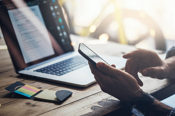 Man pointing on smartphone screen, chatting in social networks, meeting website, searching internet, sending sms, using text messenger or online banking. Close up of male hands with mobile