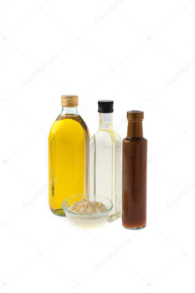 Assortment of Oils on a White Background