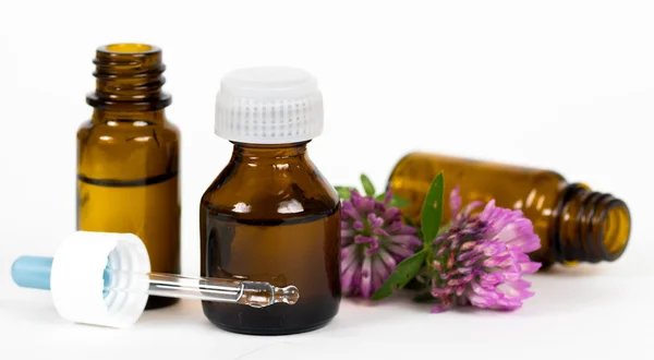 Bottles with herbal oil — Stock Photo, Image