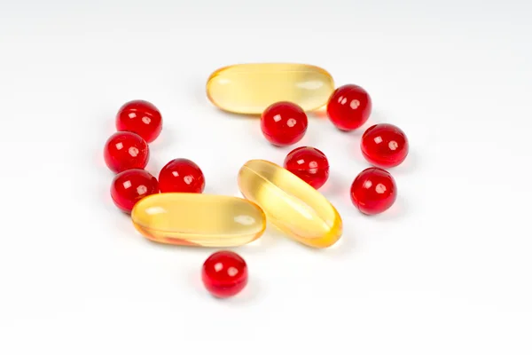 Vitamin e and cod liver oil capsules — Stock Photo, Image
