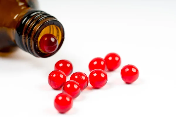 Vitamin e capsules with opened bottle — Stock Photo, Image