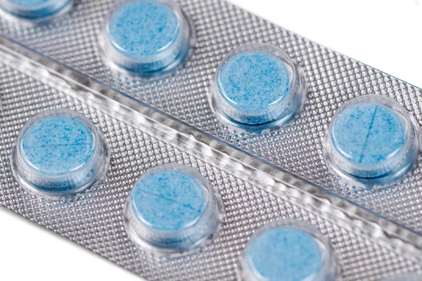 Blå runda tabletter i blister — Stockfoto