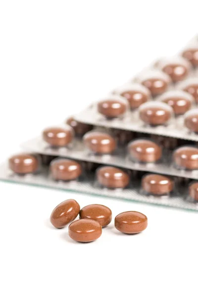 Brunt runt vitamin tablett blåsor — Stockfoto