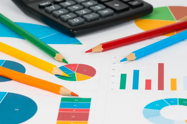 Pie and bar charts with pencils and calculator 1 — Stock Photo, Image