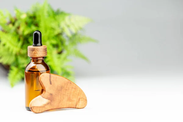 Oil Bottle Gua Sha Wooden Scraper Massager Tool Gray Background — Stock Photo, Image