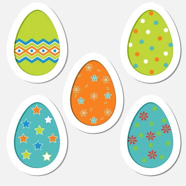 Conjunto de huevos de Pascua de colores sobre un fondo blanco — Vector de stock