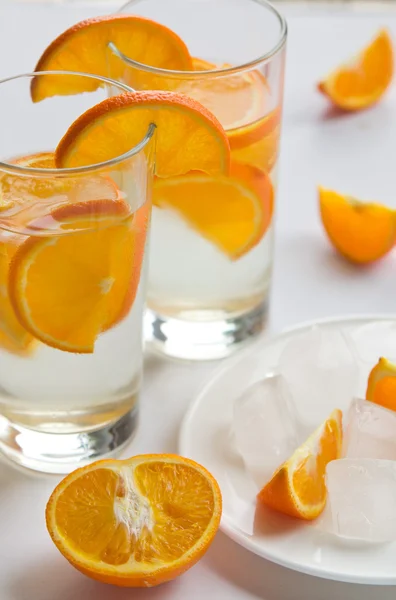 Orange lemonade in glasses — Stock Photo, Image