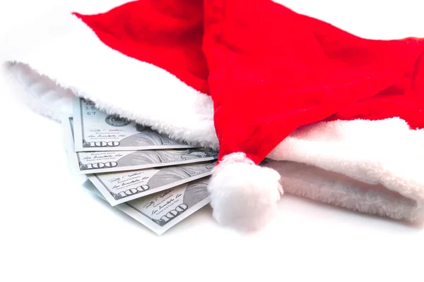 Notas de dólar no chapéu de Papai Noel isolado no fundo branco — Fotografia de Stock